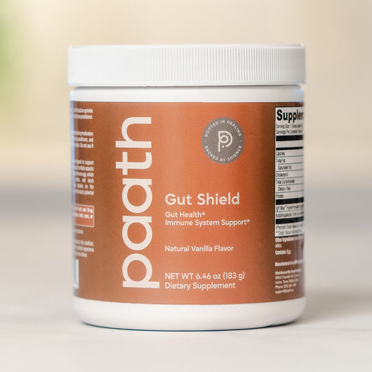 Supplement container labeled 'paath Gut Shield' on a neutral background